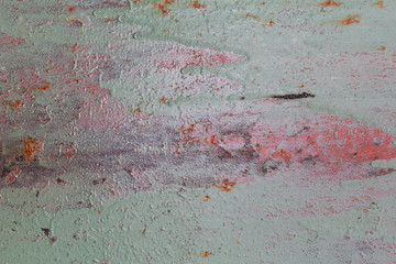 Fototapeta premium metal rusty sheet with remnants of red and green paint texture