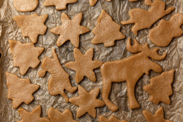 Figures Christmas trees, snowflakes from raw dough for holiday cookies