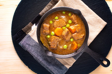 Winter Food concept homemade organic stew beef or bourguignon in Cast-Iron Skillet pan with copy space