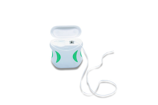 the white box of dental floss  on isolated white background