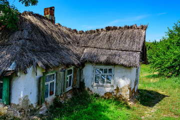 Old house in countryside with reed roof