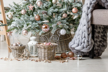 Christmas or New Year background: lamp, pink glass balls and toys, powder decoration, wool blanket