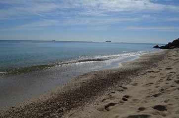 Sea rocks sand waves