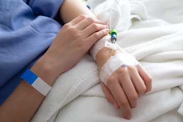 female patient sleeping on the patient bed in the room after surgery at the hospital.