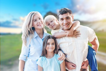 Happy cheerful family on background