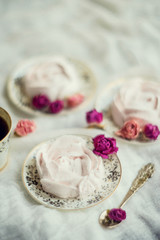 Homemade marshmallow with fresh raspberries on a textile background with a Cup of coffee. The concept of dessert and a break for sweets.
