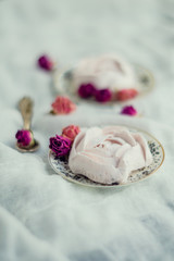 Homemade marshmallow with fresh raspberries on a textile background with a Cup of coffee. The concept of dessert and a break for sweets.