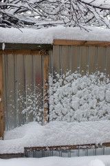Snow on the fence in winter as a background