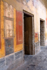 Fototapeta na wymiar Pompeii, Italy: fresco paintings on ancient Roman walls