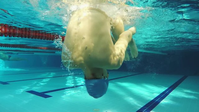Underwater view swimmer swiming crawl stroke in the pool