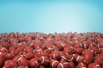 Fototapeta premium 3d rendering of endless heap of identical red leather balls for American football on blue background.