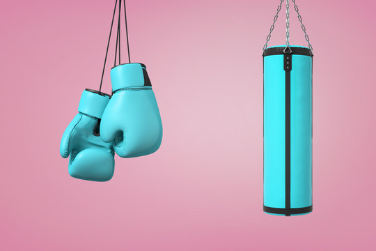 3d rendering of large pair of blue boxing mitts hangs near a blue boxing bag on a pink background.