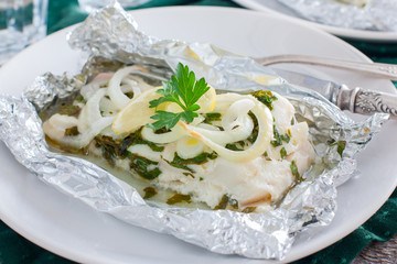Cod baked in foil with parsley and onion, horizontal