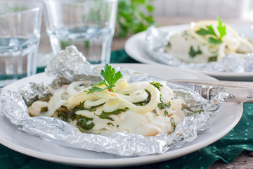 Cod baked in foil with parsley and onion, horizontal