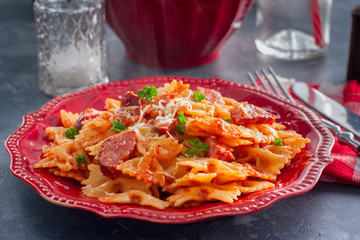 pasta with smoked sausage and cheesy tomato sauce, horizontal