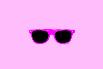 Summer pink sunglasses isolated in large seamless pink background. Minimal design element for sun...