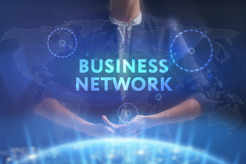 The concept of business, technology, the Internet and the network. A young entrepreneur working on a virtual screen of the future and sees the inscription: business network