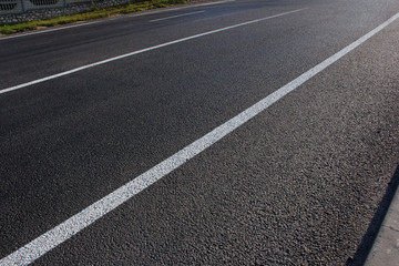 Fototapeta premium Asphalt road with marking lines white stripes