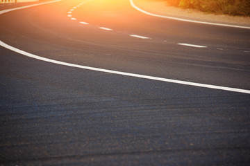 Asphalt road with marking lines white stripes