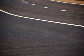 Asphalt road with marking lines white stripes