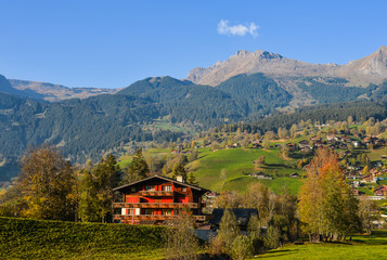 Landscape with mountain village in autumn