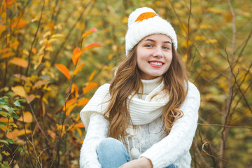 Young attractive woman in autumn colorful background
