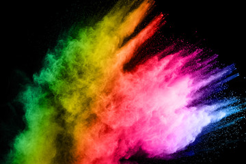 abstract colored dust explosion on a black background.abstract powder splatted background,Freeze motion of color powder exploding/throwing color powder, multicolored glitter texture.