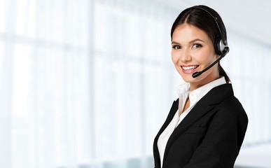 Young woman face with headphones, call center