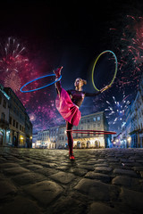 Night street circus performance whit clown, juggler. Festival city background. fireworks and...
