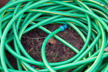 top view of hosepipe on grass, minimalistic conception.