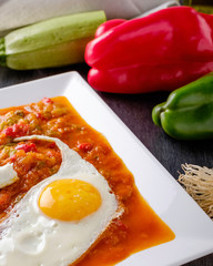 Pisto, typical Spanish food made with onions,tomatoes,peppers, zucchini and eggs.