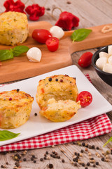 Potato gratins with mozzarella and tomatoes.