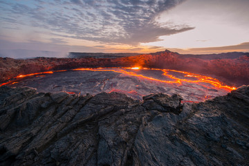 Ertale is the most active volcano of Ethiopia. This is one of the five famous volcanoes with a lava lake, as well as the world's only volcano, which has two lava lakes at once, which makes it unique. - obrazy, fototapety, plakaty