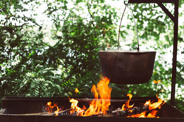 cooking in a pot on the fire in nature