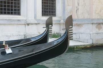Fototapeta na wymiar Two bows of gondolas