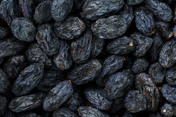 Black Raisin texture, popular dried fruit. Dried grapes.