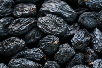 Black Raisin texture, popular dried fruit. Dried grapes.