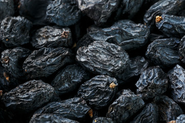 Black Raisin texture, popular dried fruit. Dried grapes.