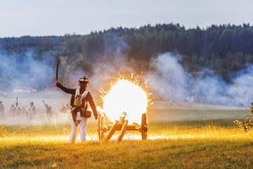 Gun Shot With Flame. Historical reconstruction of the war of 1812. The battle near Smolensk. Russia