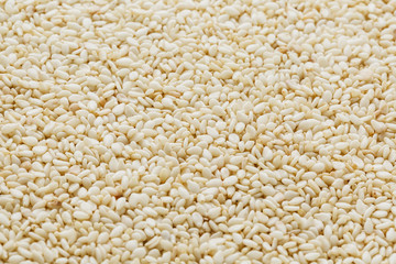 White sesame seeds background. Useful seeds for cooking