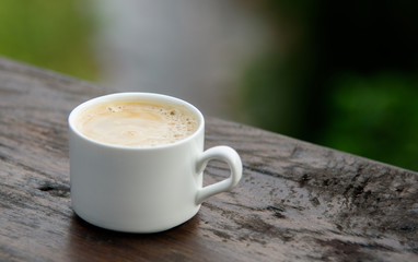 Hot latte on the beautiful nature background