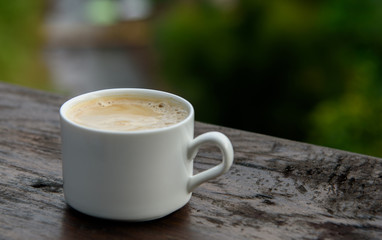 Hot latte on the beautiful nature background
