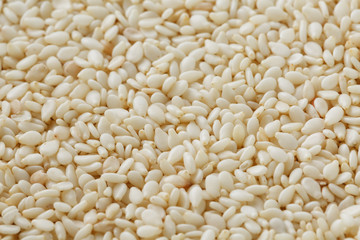 White sesame seeds background. Useful seeds for cooking