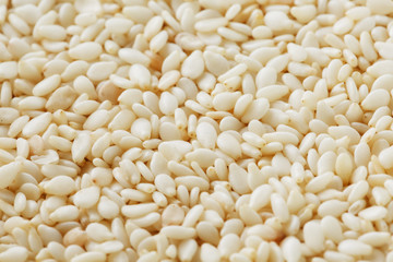 White sesame seeds background. Useful seeds for cooking