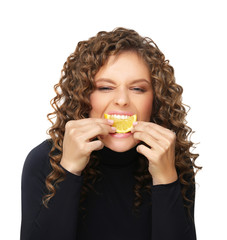 Girl holding orange slice.