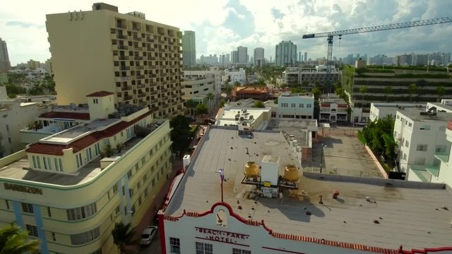 Aerial shot starting from a Cuban flag to then show Miami Beach/South Beach, FL