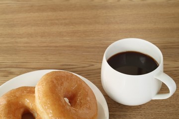 Chilled breakfast with coffee and donuts.