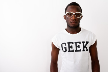Studio shot of young black African nerd man wearing Geek shirt