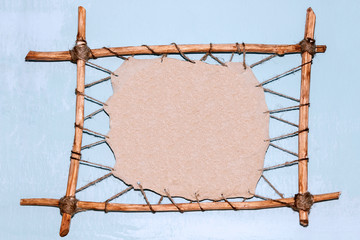Drawing on the stand of leather stretched on a wooden frame by a caveman, decoration in a cave....