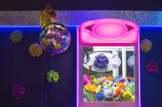 Crane claw machine with balloons
